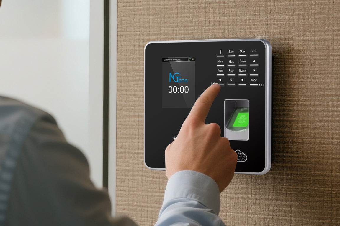 A person using a fingerprint scanner on a biometric time clock.
