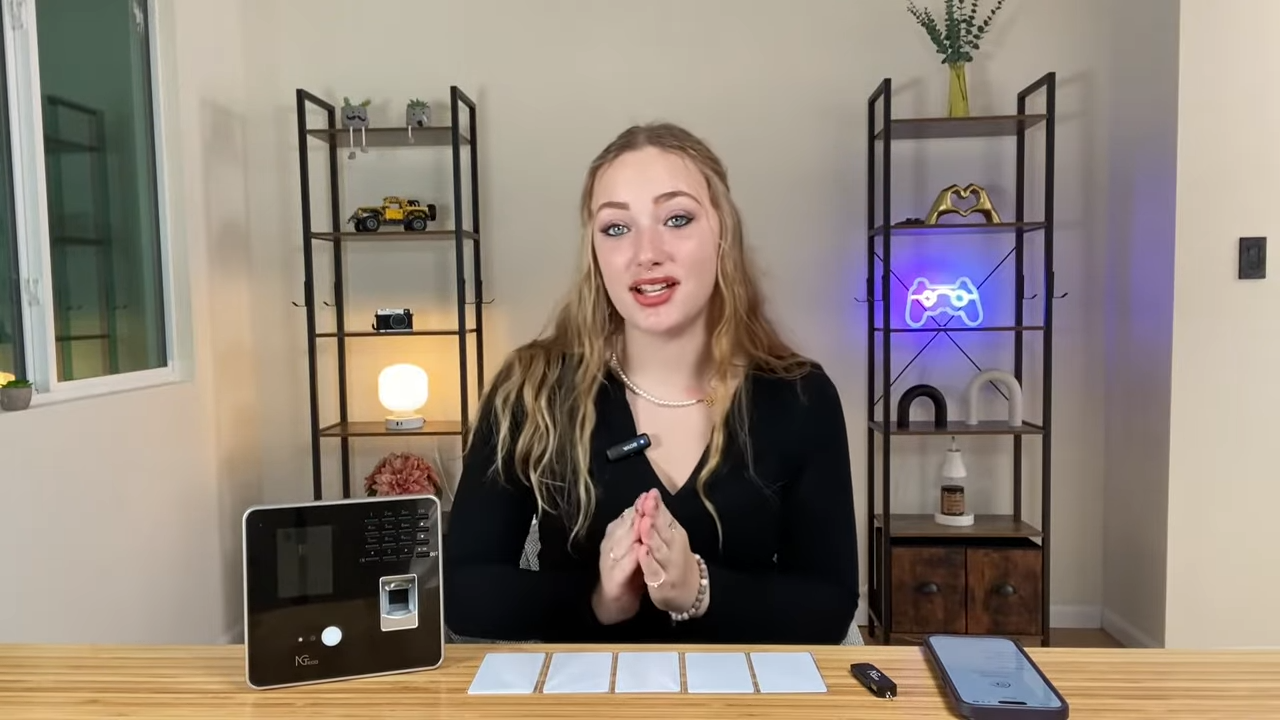 Woman presents NGTeco TC1 Smart Time Clock fingerprint access control with keypad